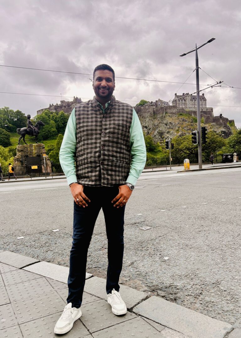rahul parwal posing for a photo on the streets of edinburg